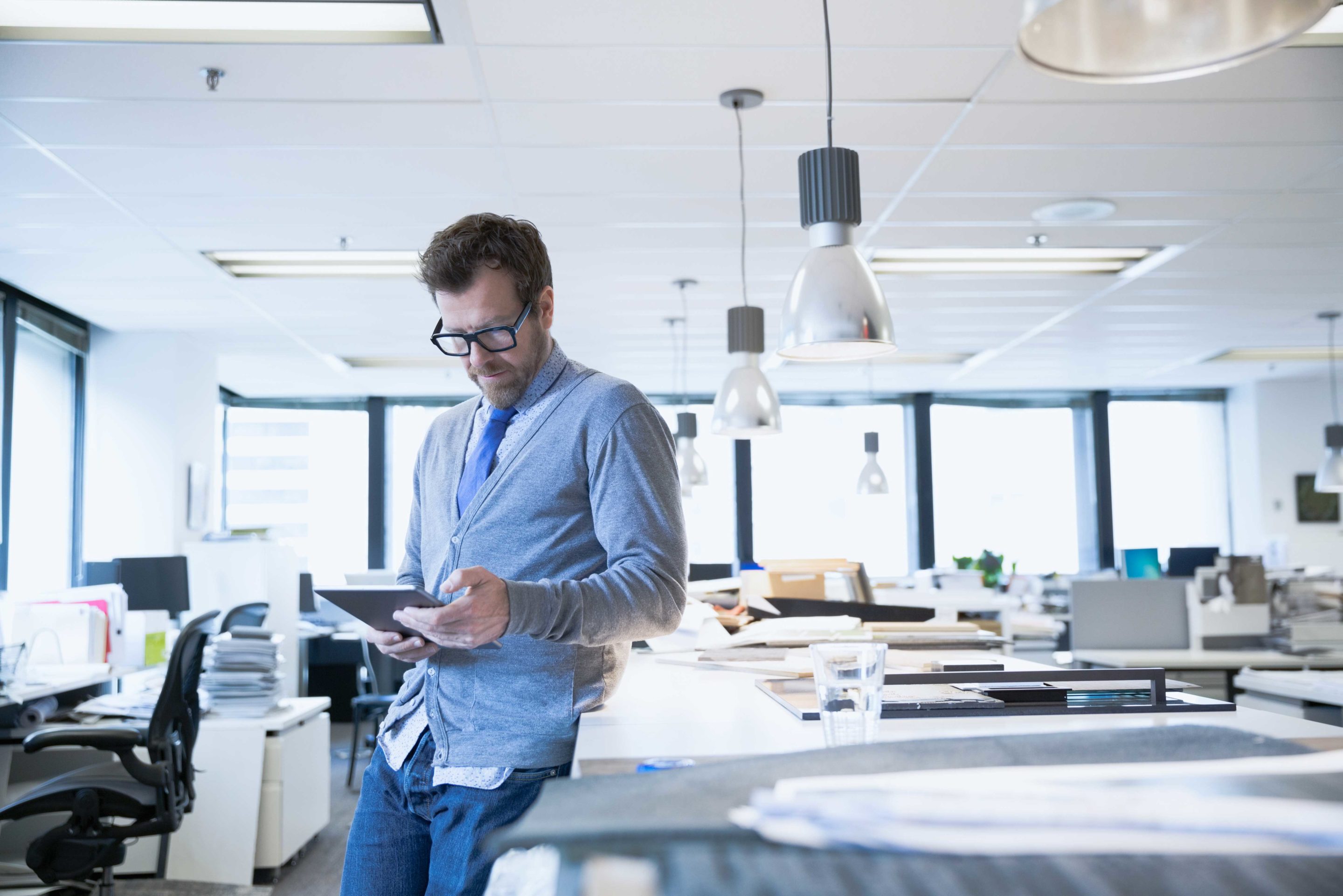 Man leaning on desk