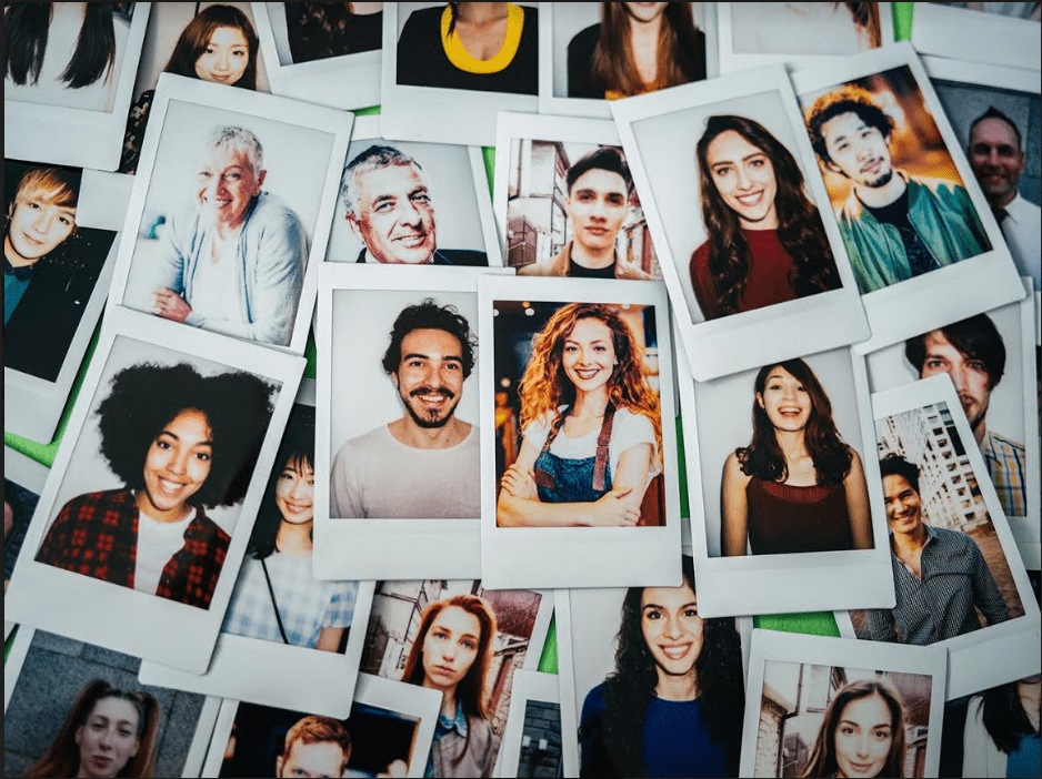 Pile of pictures of happy employees